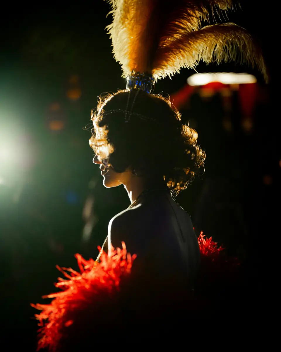 A singer in a feathered headdress at Tilly's Music Hall